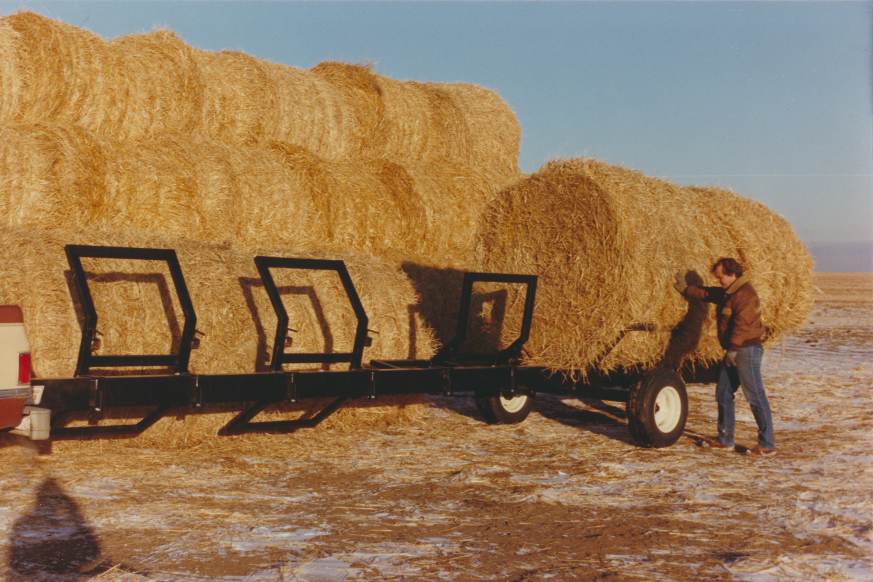 Header transport frame used as gravity dump bail cradle