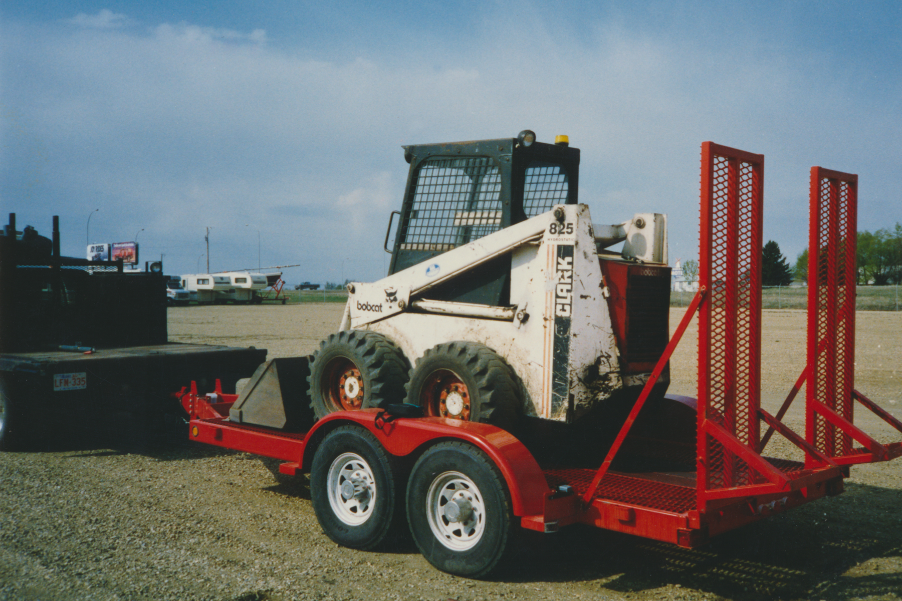 Trailer loaded with a Bobcat
